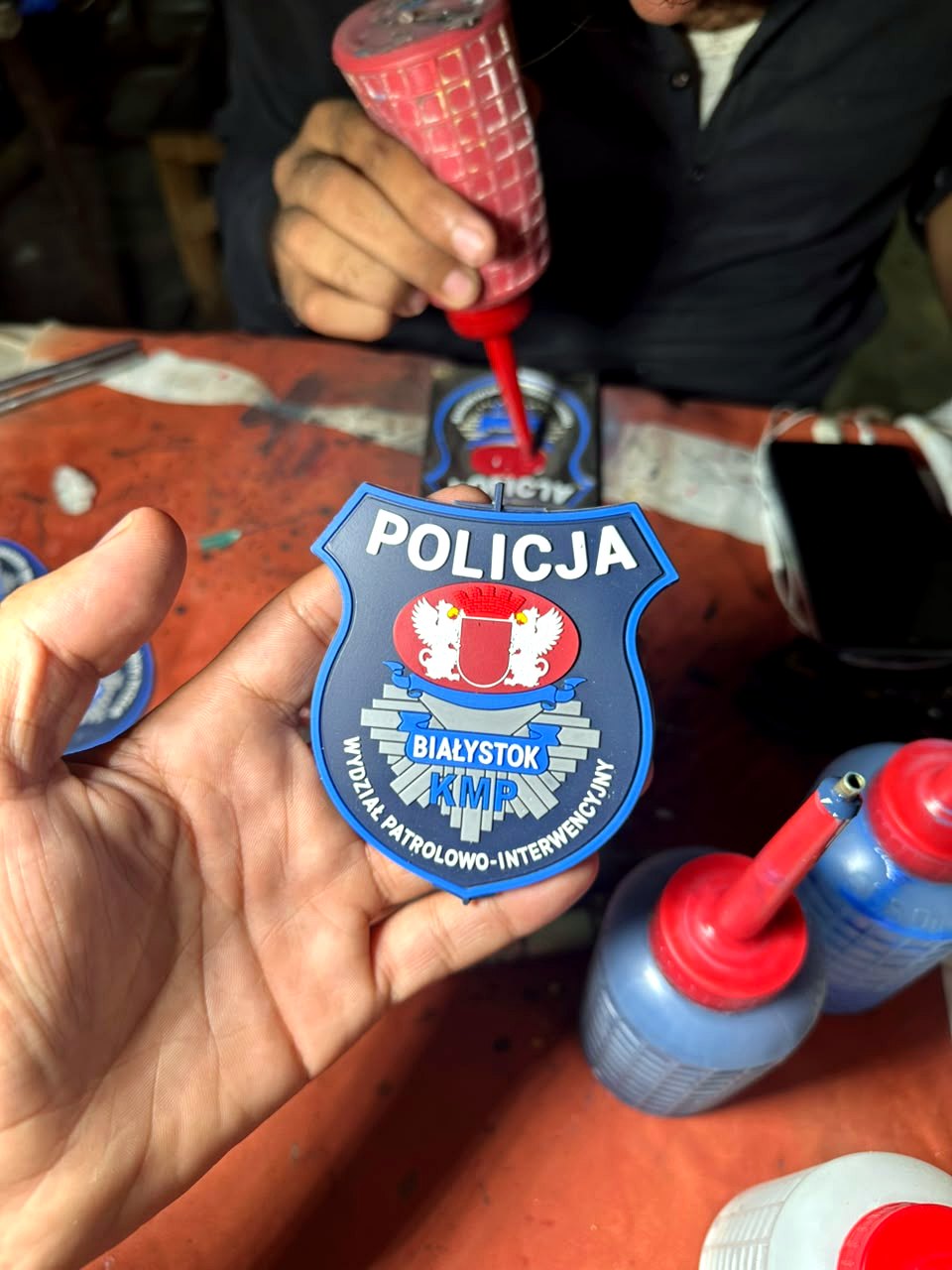 Injecting colour into a police crest mould